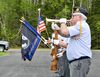 Jeff Bauers with the Baudette Ceremonial Squad plays taps Monday, May 30, 2022, at the Wabanica Cemetery north of Baudette, Minn., to honor American military veterans.