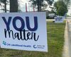 Signage placed along the street in front of CHI LakeWood focuses on raising awareness of suicide. Photos by Shawna Wendler